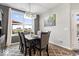 Dining room features large windows, a modern light fixture and neutral decor at 3463 Sunnyvale Dr, Brownsburg, IN 46112