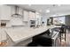 Spacious kitchen island with stone countertops, seating, and stainless steel appliances, perfect for cooking and entertaining at 3463 Sunnyvale Dr, Brownsburg, IN 46112