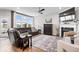 Well-lit living room with fireplace, large windows, and access to the backyard at 3463 Sunnyvale Dr, Brownsburg, IN 46112