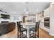 Open concept living room and kitchen, featuring a fireplace, and modern finishes at 3463 Sunnyvale Dr, Brownsburg, IN 46112
