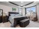 Serene main bedroom with tray ceilings, large windows and stylish furnishings at 3463 Sunnyvale Dr, Brownsburg, IN 46112