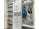 Custom walk-in closet with drawers, shelves, cabinets, and a comfortable sitting area at 3463 Sunnyvale Dr, Brownsburg, IN 46112