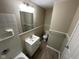 This bathroom features a tiled shower and tub with a single sink vanity with a laminate countertop at 3742 N Wittfield St, Indianapolis, IN 46235