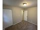 Neutral bedroom featuring plush carpeting and a closet with bi-fold doors and neutral walls at 3742 N Wittfield St, Indianapolis, IN 46235