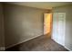 Bedroom showcases neutral walls, carpeting and a built in closet with bi-fold doors at 3742 N Wittfield St, Indianapolis, IN 46235