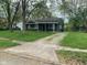 Charming single-story home featuring a cozy porch and a well-maintained lawn at 3742 N Wittfield St, Indianapolis, IN 46235