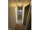 Long narrow hallway with neutral walls and carpet leading to the bedrooms and bathrooms at 3742 N Wittfield St, Indianapolis, IN 46235