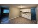 Bright kitchen featuring modern white cabinets, a double sink, and vinyl floors at 3742 N Wittfield St, Indianapolis, IN 46235