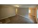 Inviting living room featuring neutral walls, plush carpet, and a hallway entrance at 3742 N Wittfield St, Indianapolis, IN 46235
