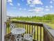 Outdoor balcony with patio furniture and scenic pond view at 3948 Saddle Club S Pkwy, Bargersville, IN 46106