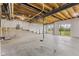 Unfinished basement with concrete floor and walkout to backyard at 3948 Saddle Club S Pkwy, Bargersville, IN 46106