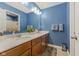 Bathroom featuring a vanity with double sinks and large mirror at 3948 Saddle Club S Pkwy, Bargersville, IN 46106