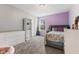 Bedroom featuring a bed, dresser, and bright natural lighting at 3948 Saddle Club S Pkwy, Bargersville, IN 46106