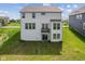 Back exterior of house with a large yard and patio at 3948 Saddle Club S Pkwy, Bargersville, IN 46106
