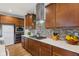 Well-lit kitchen featuring wooden cabinets, quartz countertops, and stainless steel appliances at 3948 Saddle Club S Pkwy, Bargersville, IN 46106