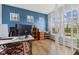 Bright home office featuring built-in shelves, ample natural light, and hardwood floors at 3948 Saddle Club S Pkwy, Bargersville, IN 46106