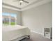 Comfortable bedroom offering a ceiling fan, neutral decor, plush carpet, and a well-lit atmosphere at 4367 Homestead Dr, Whitestown, IN 46075