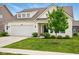 Pleasant home with a tidy front lawn, an attached garage, and a welcoming entrance at 4367 Homestead Dr, Whitestown, IN 46075