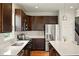 Well-lit kitchen with stainless steel appliances and white countertops at 4367 Homestead Dr, Whitestown, IN 46075