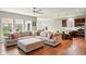 Open-concept living area seamlessly integrating the kitchen and dining spaces, with hardwood floors and ample seating at 4367 Homestead Dr, Whitestown, IN 46075