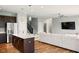 Open concept living space with kitchen island and comfortable seating area at 4367 Homestead Dr, Whitestown, IN 46075
