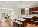 Open concept living space with kitchen island and dining area at 4367 Homestead Dr, Whitestown, IN 46075