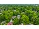 Aerial view of a home nestled in a neighborhood with mature trees, highlighting its desirable location at 4410 N Pennsylvania St, Indianapolis, IN 46205
