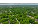 Sprawling aerial view of the suburb, with tree-lined streets and well-maintained homes at 4410 N Pennsylvania St, Indianapolis, IN 46205