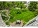 Beautiful backyard featuring a well-maintained lawn, patio with outdoor seating, and lush landscaping at 4410 N Pennsylvania St, Indianapolis, IN 46205