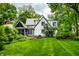 Well-maintained backyard featuring lush greenery and an inviting exterior view of the charming home at 4410 N Pennsylvania St, Indianapolis, IN 46205