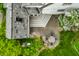 Backyard aerial view highlighting a patio, outdoor seating area, landscaping, and flowering plants at 4410 N Pennsylvania St, Indianapolis, IN 46205