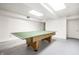 Unfinished basement with a ping pong table, offering potential for customization and additional living space at 4410 N Pennsylvania St, Indianapolis, IN 46205