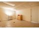 Basement features tile flooring, and unfinished yellow walls at 4410 N Pennsylvania St, Indianapolis, IN 46205