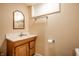 Small bathroom boasts a single vanity, wallpaper, and a large mirror at 4410 N Pennsylvania St, Indianapolis, IN 46205