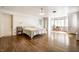 Large bedroom with wood floors, natural light, and ample closet space at 4410 N Pennsylvania St, Indianapolis, IN 46205