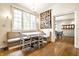 Breakfast nook with a built-in bench, a table, and a view of the backyard at 4410 N Pennsylvania St, Indianapolis, IN 46205
