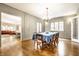 Formal dining room with hardwood floors, chandelier, and large windows at 4410 N Pennsylvania St, Indianapolis, IN 46205