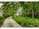 Inviting two-story home with a well-manicured lawn and mature trees at 4410 N Pennsylvania St, Indianapolis, IN 46205