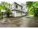 Beautiful home exterior with a two-car garage, classic design, and lush greenery surrounding the property at 4410 N Pennsylvania St, Indianapolis, IN 46205