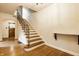 Elegant foyer with staircase and hardwood floors at 4410 N Pennsylvania St, Indianapolis, IN 46205
