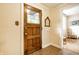 Classic wood front door with decorative glass, opening to an elegant foyer at 4410 N Pennsylvania St, Indianapolis, IN 46205