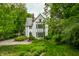 Charming home with a beautiful facade, mature trees, and manicured landscaping, showcasing curb appeal at 4410 N Pennsylvania St, Indianapolis, IN 46205
