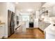 Bright, open kitchen with white cabinets, stainless steel appliances and hardwood floors at 4410 N Pennsylvania St, Indianapolis, IN 46205