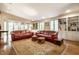 Spacious living room with hardwood floors, built-in bookshelves, and plenty of natural light at 4410 N Pennsylvania St, Indianapolis, IN 46205
