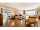 Inviting living room showcasing hardwood floors, a bay window, and a neutral color palette at 4410 N Pennsylvania St, Indianapolis, IN 46205