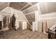 Spacious unfinished attic with visible beams, exposed plywood and hardwood floors at 4410 N Pennsylvania St, Indianapolis, IN 46205