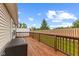 Spacious back deck with wooden railings overlooking the backyard at 4907 Franklin Villas Pl, Indianapolis, IN 46237
