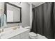 Elegant bathroom featuring a framed mirror and a shower with curtain at 4907 Franklin Villas Pl, Indianapolis, IN 46237
