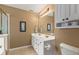 Bathroom featuring a double vanity, ample storage, and tile floors at 4907 Franklin Villas Pl, Indianapolis, IN 46237