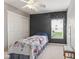 This bedroom features a closet, neutral carpet, and a window for natural light at 4907 Franklin Villas Pl, Indianapolis, IN 46237